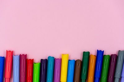 Close-up of colored pencils against white background