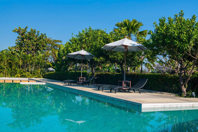 Scenic view of pool against blue sky