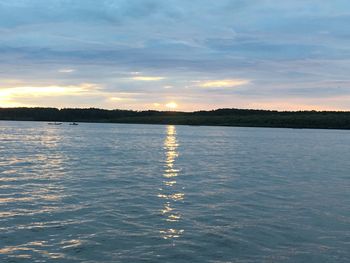 Scenic view of lake at sunset