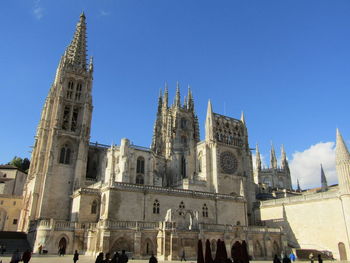 Low angle view of church against clear blue sky