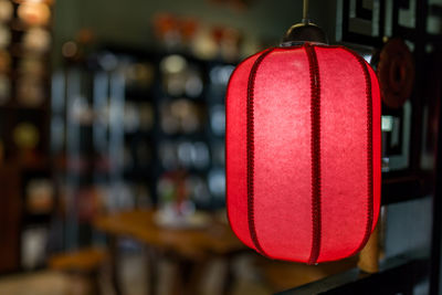 Close-up of illuminated lanterns hanging in restaurant