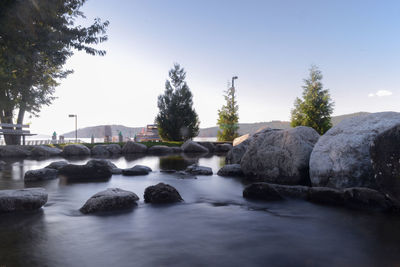 River amidst rocks against clear sky
