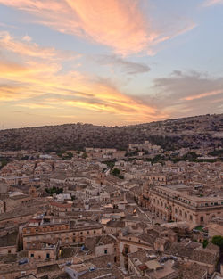 High angle view of townscape against sky during sunset