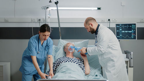 Female doctor examining patient at clinic