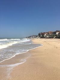 Scenic view of beach against clear sky