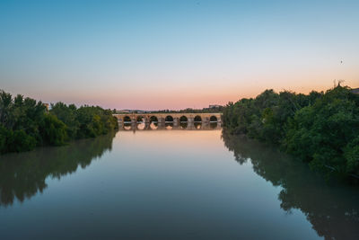 Bridge over river against clear sky