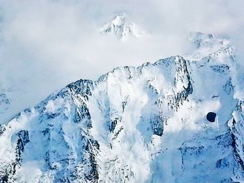 Scenic view of snow covered mountains