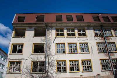 Low angle view of building against clear blue sky