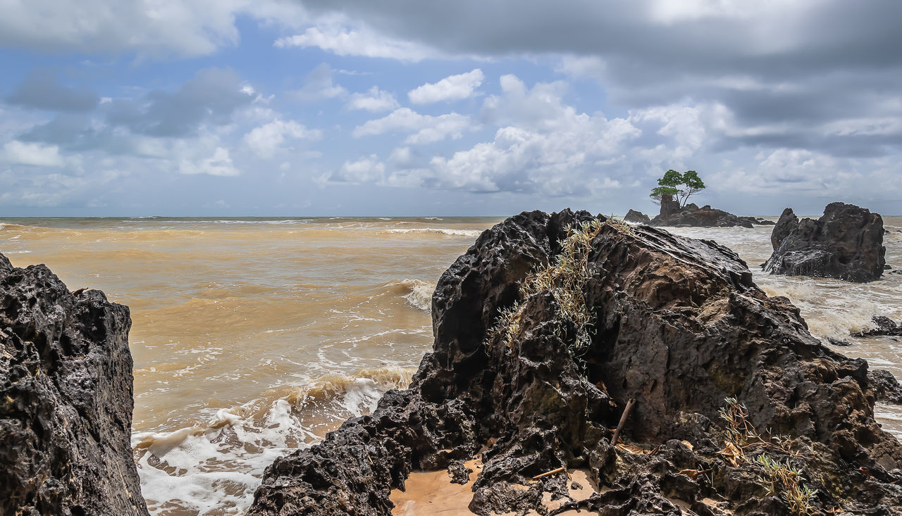 VIEW OF ROCKS ON BEACH AGAINST SKY