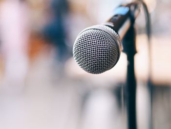 Close-up of microphone outdoors during sunny day
