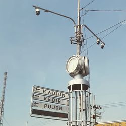 Low angle view of street light against sky