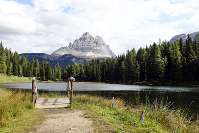 Scenic view of lake and mountains against sky