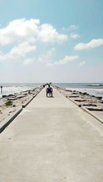 Scenic view of sea against cloudy sky