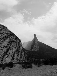 Scenic view of mountain against cloudy sky