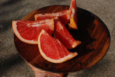 Close-up of hand holding strawberry