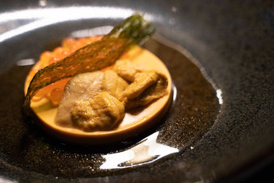 High angle view of meat in plate on table