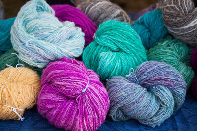 Close-up of colorful string bundles on table