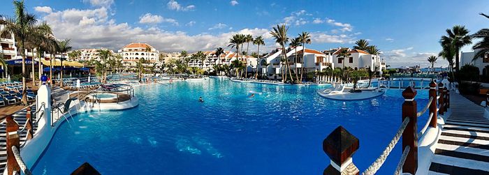 Panoramic view of swimming pool against sky