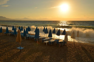 Scenic view of beach against sky during sunset