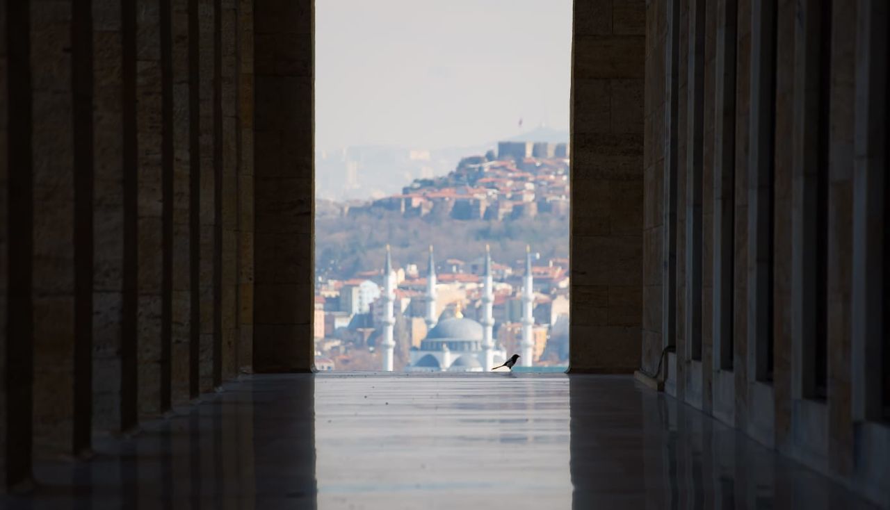 VIEW OF CITY BUILDINGS THROUGH WINDOW