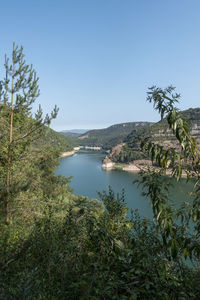 Scenic view of bay against clear sky