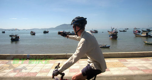 Full length of man on sea against sky