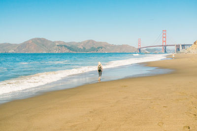 Woman standing on beach