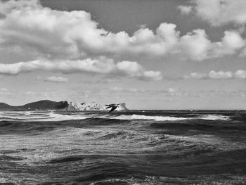 View of beach against cloudy sky