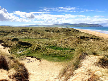 Scenic view of land against sky