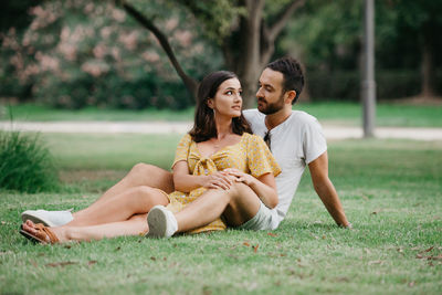 Romantic couple relaxing at park