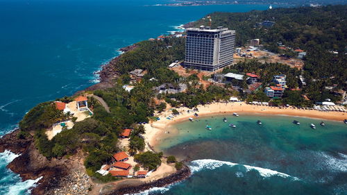 High angle view of buildings by sea