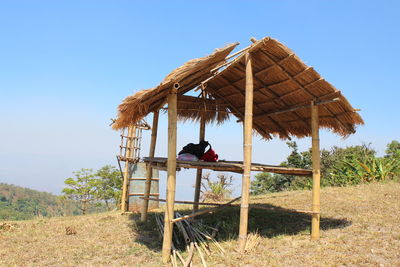 Built structure on field against clear sky