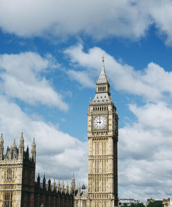Low angle view of clock tower against sky