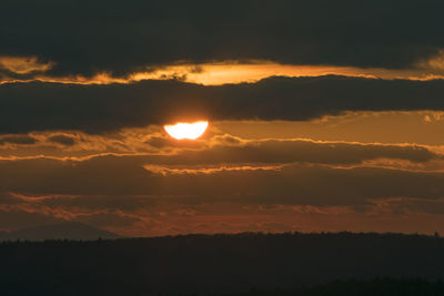 Scenic view of silhouette landscape against romantic sky at sunset