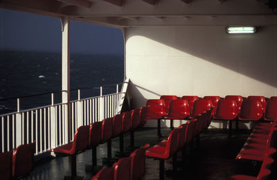 Empty red chairs in ferry