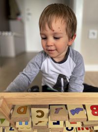 Portrait of cute boy looking at home