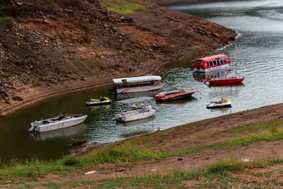 High angle view of boats moored on shore