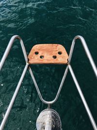 High angle view of chair in swimming pool