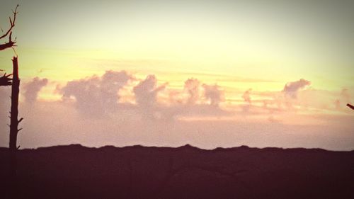 Scenic view of landscape against sky at sunset