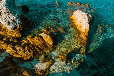 High angle view of rock formation in sea