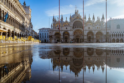 Reflection of historic cathedral by river