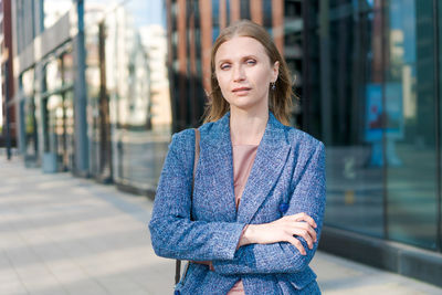 Happy business woman with professional appearance smiling confidently in city