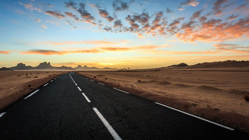 Road against sky at sunset