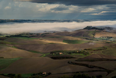 Aerial view of agricultural landscape against sky