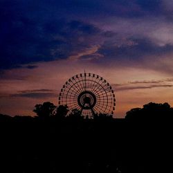 Silhouette ferris wheel against sky during sunset