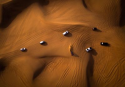 High angle view of vehicles on desert