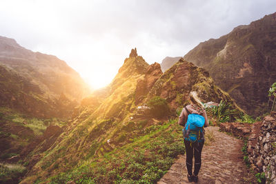 Girl walking in xo-xo valley. warm sunlight seable on horizont. santo antao island cape verde