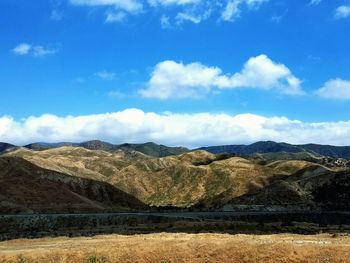 Scenic view of landscape and mountains against sky