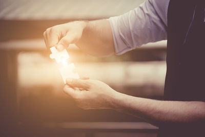 Close-up of man holding hands