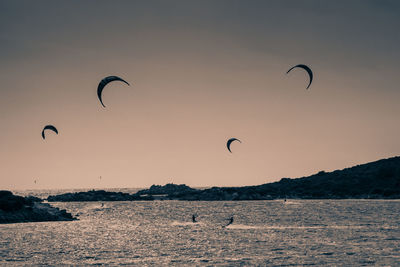 Hot air balloon flying over sea